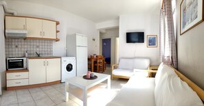 Family Apartment, Multiple Beds, City View | Living area | Flat-screen TV