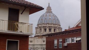 A building with a dome and a balcony.