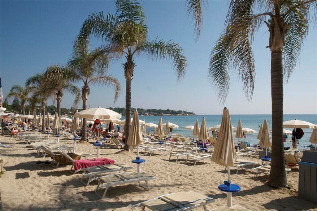 On the beach, sun-loungers