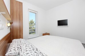 2 chambres, coffre-fort, accès au Wi-Fi (inclus), literie fournie