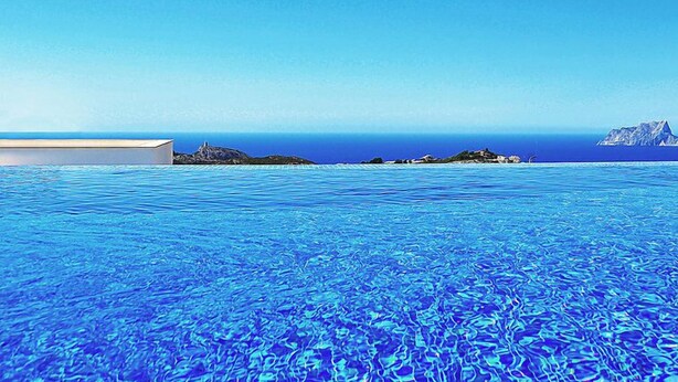 An infinity pool with a clear view of the ocean and distant islands. - Vacation home Megin by Interhome (Moraira)
