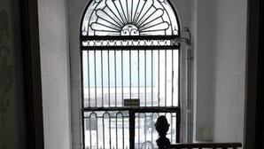 A staircase with a wrought iron railing leading to a gated entrance. - La Bamba Student Hostel (Buenos Aires)
