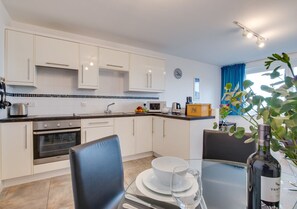 Fridge, microwave, oven, cookware/dishes/utensils
