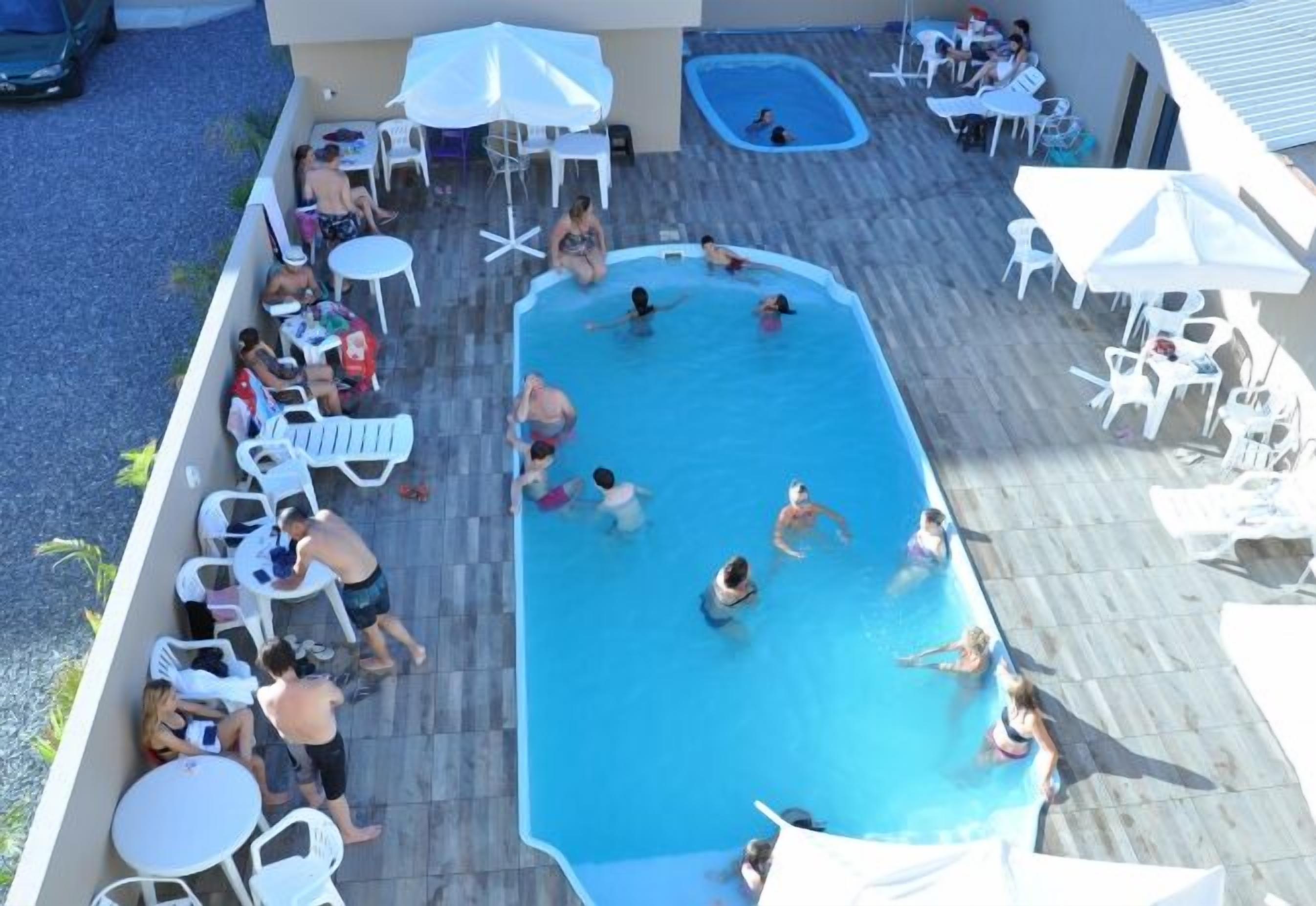 seasonal outdoor pool, pool umbrellas, pool loungers