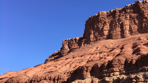 A rocky cliff with a river at its base. - Luxury Glamping!  Near Horseshoe, Antelope Canyon, Lake Powell, Grand Canyon.' (Page)