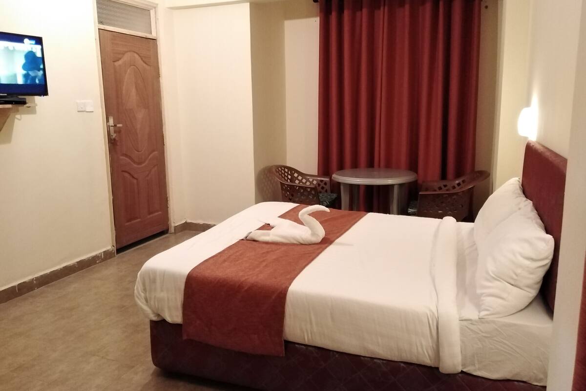 Deluxe Double Room, Garden View | In-room safe, desk, laptop workspace, blackout drapes