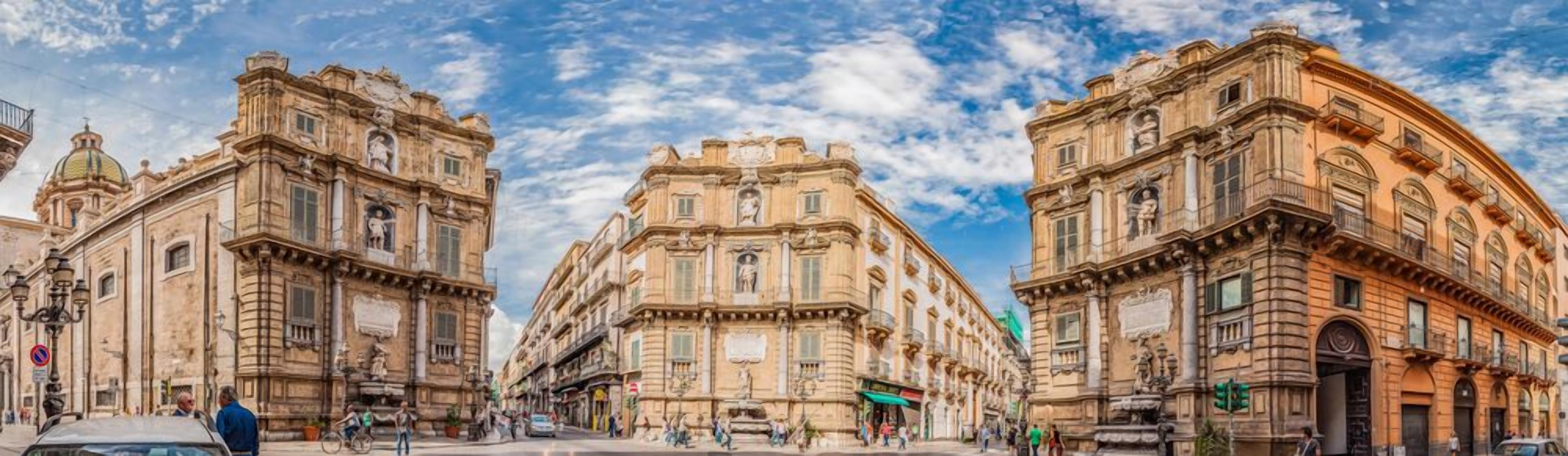 A historic building with classical architecture, featuring ornate facades and detailed stonework.