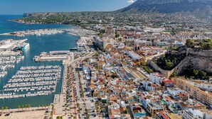 An aerial view of a coastal city with a marina, historic buildings, and a mountain in the background. - Caseta Blanqueta by Interhome (Dénia)