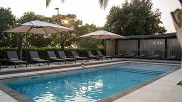 Seasonal outdoor pool, open 11:00 AM to 7:00 PM, free cabanas