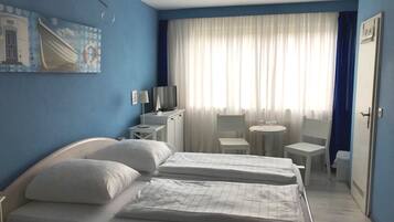 Triple Room | 2 bedrooms, individually furnished, laptop workspace, blackout drapes