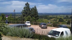 A parking area with several cars, a lamppost, and a sign indicating no parking. - Cottage in Saint-Haon-le-Châtel with pool and pets allowed (Saint-Haon-le-Châtel)