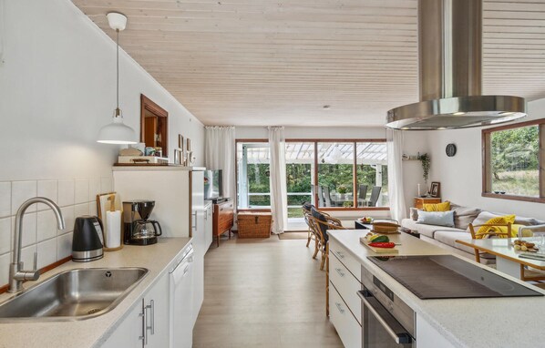 Fridge, stovetop, dishwasher, coffee/tea maker