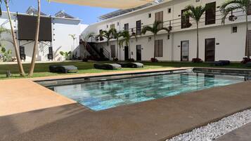 Outdoor pool, open 9:00 AM to 9:00 PM, pool umbrellas