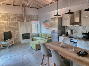 Smart TV, fireplace, table football, books
