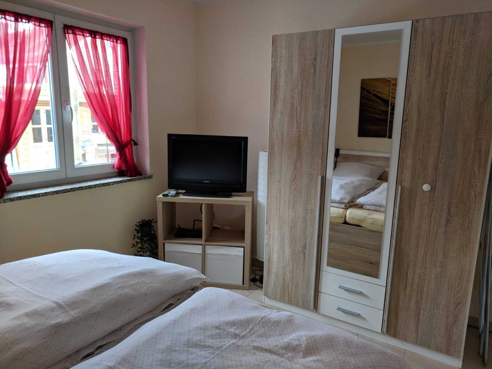 1 bedroom, desk, iron/ironing board, travel crib