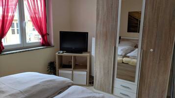 1 bedroom, desk, iron/ironing board, travel crib