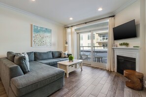 TV, fireplace - Luxury Bayfront Condo 1 Block from the Beach, at Lighthouse Cove (Dewey Beach)