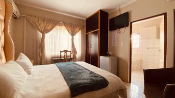 In-room safe, desk, laptop workspace, blackout curtains