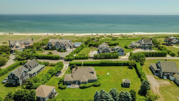 A coastal residential area with houses, a beach, and a clear view of the ocean. - Steps to Nauset Beach, Private Yard! (Orleans)
