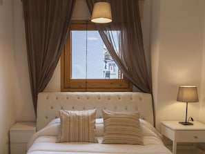 Restful retreat with a large bed and comfortable seating area.