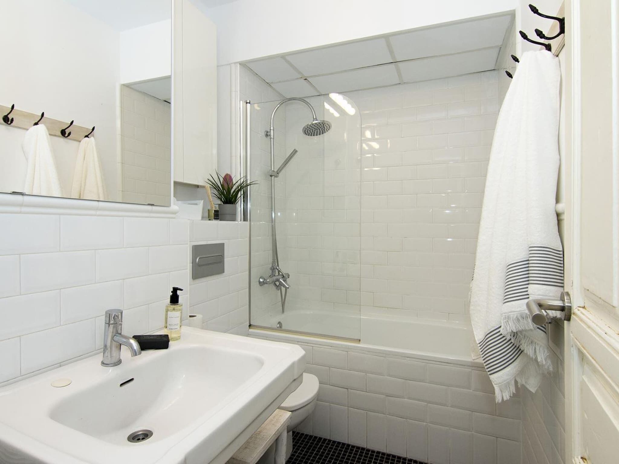 Bathtub, hair dryer, towels, soap