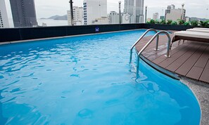 Swimmers can enjoy a refreshing dip in the pool surrounded by a spacious deck area.