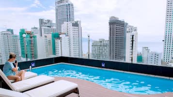 Outdoor pool, open 7:00 AM to 10:00 PM, pool loungers