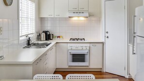 Microwave, oven, stovetop, dining tables