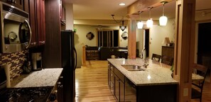 Fridge, microwave, oven, stovetop - The Hangout hot tub cottage on Big Pine Island Lake (Belding)