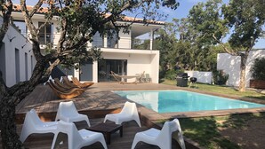 A modern house with a swimming pool, outdoor furniture, and a barbecue area. - South Corsica, Villa 14 p, swimming pool, beach at 300m (Sainte-Lucie de Porto-Vecchio)