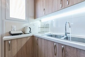 Apartment | Private kitchen | Full-size fridge, oven, stovetop, electric kettle - Stylish Athenian Flat (Athens)