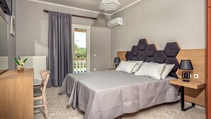 A bedroom with a bed, bedside tables, a desk, and a chair. - Villa Eleon with private pool, BBQ and beautiful garden. (Zakynthos)