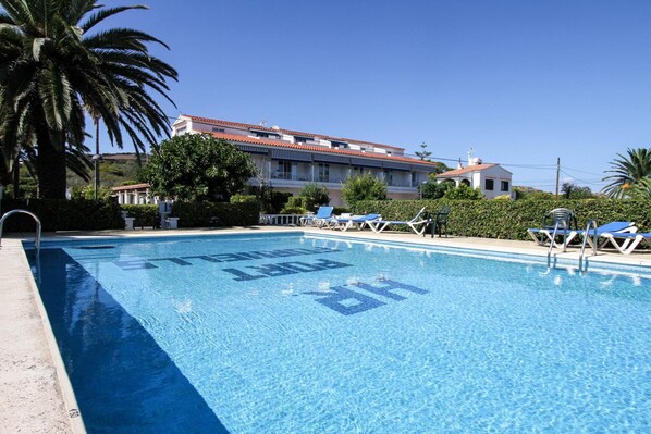 Outdoor pool, open 8:30 AM to 8:00 PM, pool umbrellas, pool loungers