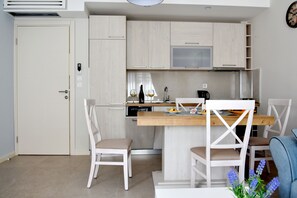 Apartment, 1 Bedroom | Living area | Flat-screen TV, DVD player