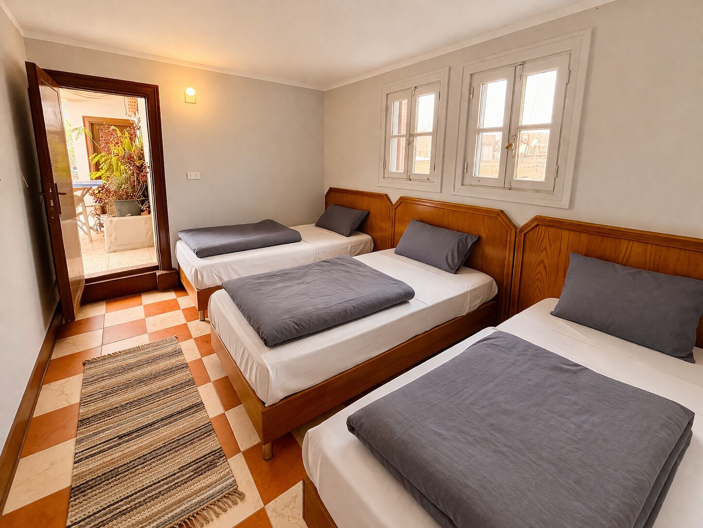 Triple Room, Private Bathroom | Blackout drapes, free WiFi, bed sheets