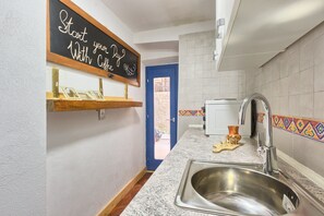 Apartment | Private kitchen | Fridge, microwave, stovetop, cookware/dishes/utensils