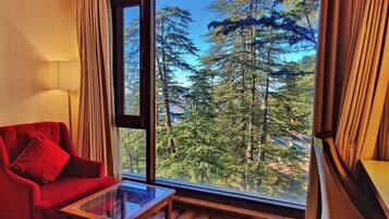 Royale Deluxe | Living area | 32-inch LED TV with satellite channels, TV