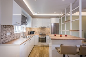 Family Villa, Sea View | Private kitchen | Fridge, microwave, oven, stovetop