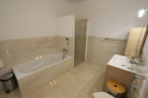 Bathtub, hair dryer, towels