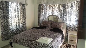 Blackout curtains, iron/ironing board, free WiFi, bed sheets