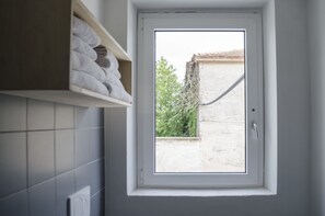 Basic Apartment | Bathroom amenities | Shower, bidet, towels
