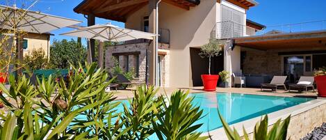 Outdoor pool, pool umbrellas, pool loungers