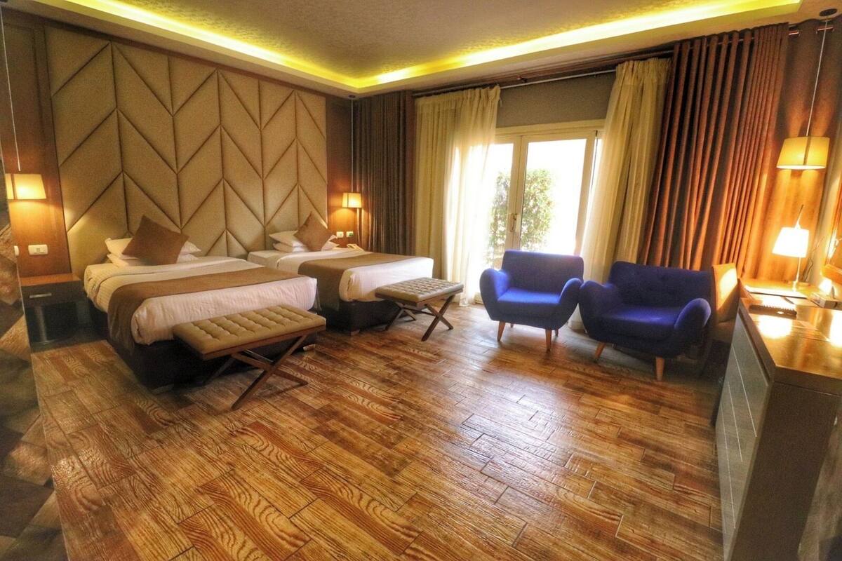 Family Suite, Pool View | Minibar (free items), desk, blackout drapes, WiFi (free)