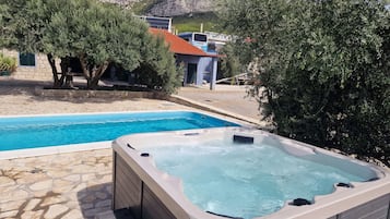 Seasonal outdoor pool, pool loungers