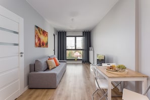 Deluxe-Apartment | Wohnbereich | Flachbildfernseher