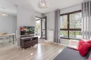 Premium Apartment, 2 Bedrooms | Living room | Flat-screen TV