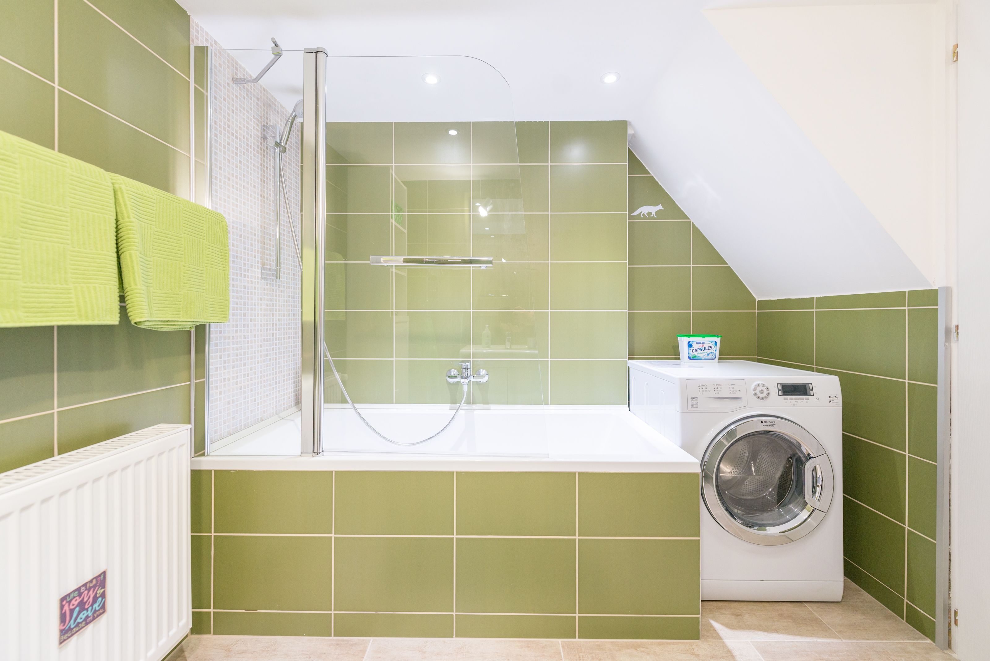 design apartment, 1 queen bed with sofa bed (green) | bathroom | hair dryer, towels, soap, shampoo