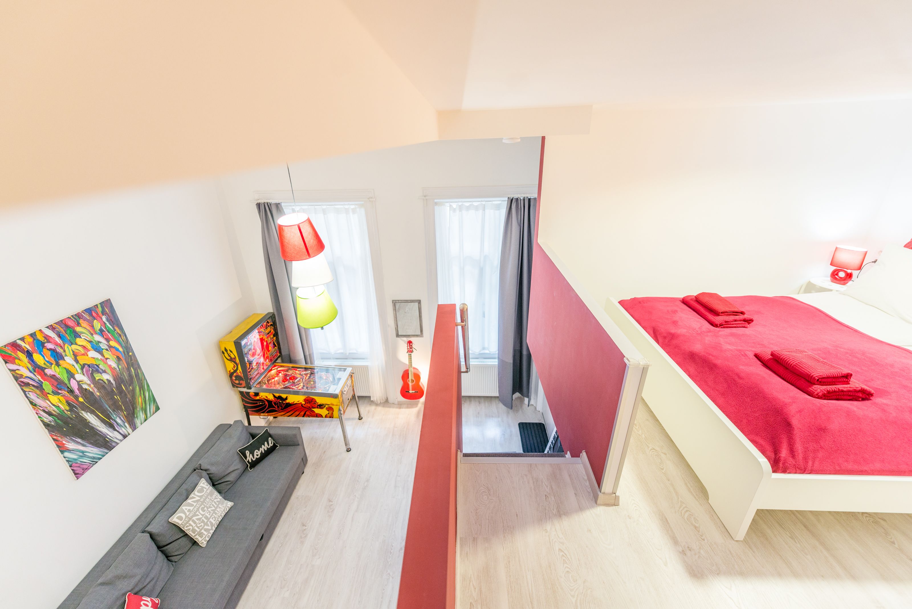 design apartment, 1 queen bed with sofa bed (red) | individually decorated, desk, laptop workspace, blackout curtains