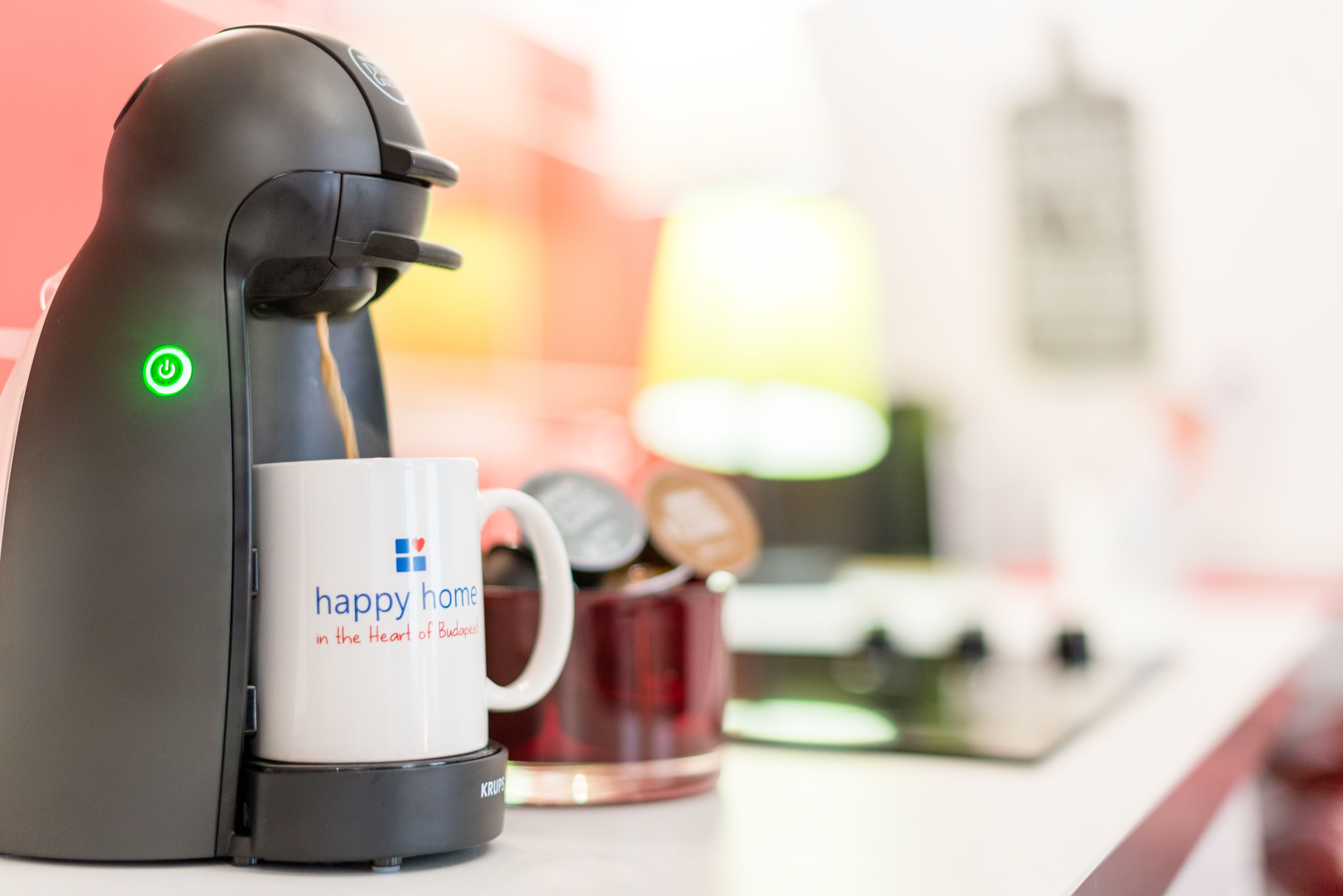 design apartment, 1 queen bed with sofa bed (red) | coffee and/or coffee maker