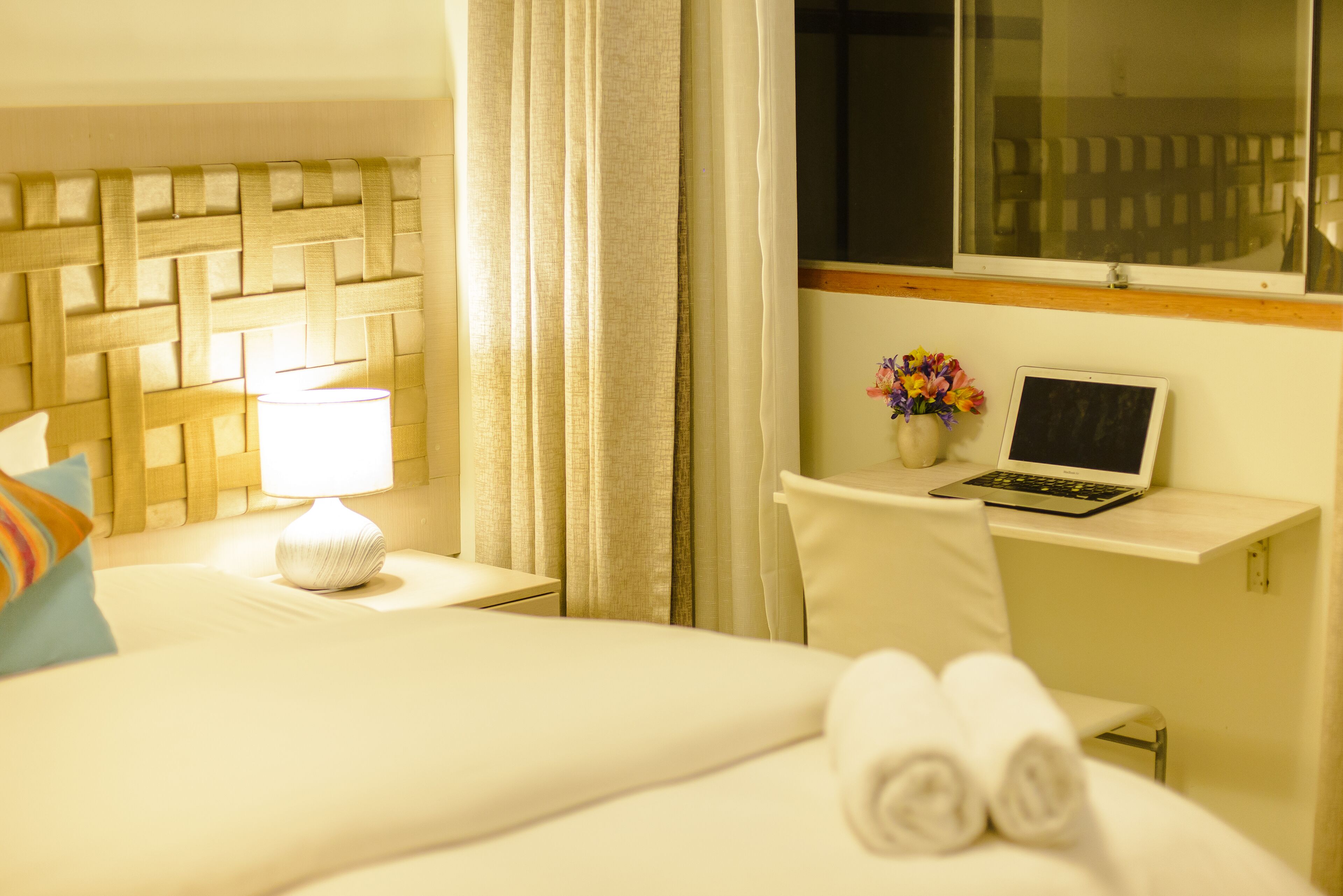 deluxe single room, 1 queen bed | in-room safe, desk, iron/ironing board, free wifi